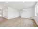 Spacious living area with wood-look flooring and lots of natural light; great for entertaining guests at 6636 N Nepal St, Aurora, CO 80019