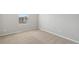 Bedroom with neutral walls, plush carpeting, and a light-filled window at 7330 Green River Ave, Frederick, CO 80530