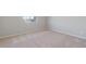 Cozy carpeted bedroom featuring a window and neutral walls at 7330 Green River Ave, Frederick, CO 80530