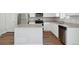 Bright kitchen featuring granite counters, stainless steel appliances, and a center island at 7330 Green River Ave, Frederick, CO 80530
