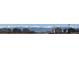 Street view of houses with snow-capped mountain backdrop in the distance at 7330 Green River Ave, Frederick, CO 80530