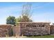 Entrance to Hidden Creek community with decorative stone wall and manicured landscape at 7330 Green River Ave, Frederick, CO 80530