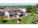 Spacious backyard with a well-maintained lawn, patio area, and a playset at 11513 Greenbriar Ln, Parker, CO 80138