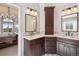 Bathroom with dual vanities, granite countertops and plenty of storage space at 11513 Greenbriar Ln, Parker, CO 80138