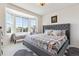 Cozy bedroom featuring a large bay window, and a neutral color palette at 11513 Greenbriar Ln, Parker, CO 80138