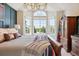 Bedroom showcasing a large window with great natural light and traditional furniture at 11513 Greenbriar Ln, Parker, CO 80138