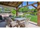 The covered patio dining area provides plenty of room for entertaining Gathering and friends at 11513 Greenbriar Ln, Parker, CO 80138