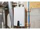 On-demand water heater in basement with digital display for temperature at 11513 Greenbriar Ln, Parker, CO 80138