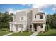 Modern townhome with varied siding, manicured landscaping, and inviting entryway, offering a contemporary living space at 4594 S Versailles St # B, Aurora, CO 80015