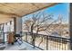 Comfortable covered balcony with a grill and city views at 275 S Harrison St # 210, Denver, CO 80209