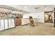 Common area with table, chairs and plants under track lighting. Windows allow natural light to brighten the space at 275 S Harrison St # 210, Denver, CO 80209