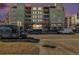 Condo building with a purple sunset and convenient street parking at 275 S Harrison St # 210, Denver, CO 80209