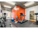 Well-equipped gym with treadmill, weights, and ample space for various fitness activities in a shared community space at 275 S Harrison St # 210, Denver, CO 80209