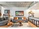 Inviting living area featuring wood floors, gray furniture, and modern decor at 275 S Harrison St # 210, Denver, CO 80209