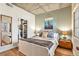 Inviting bedroom with closet, hardwood floors, accent wall and soft, natural light at 275 S Harrison St # 210, Denver, CO 80209