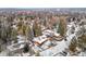 An expansive view of the home, neighborhood, and community from above, with snowy rooftops and mature trees at 1333 Mariposa Ave, Boulder, CO 80302