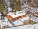 An aerial view of the home reveals a well-maintained property with mature trees, a gazebo, and snow-covered ground at 1333 Mariposa Ave, Boulder, CO 80302