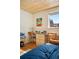 Bedroom featuring a desk, wood ceiling, and view of a pergola through the window at 1333 Mariposa Ave, Boulder, CO 80302