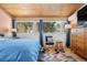 Bedroom with large windows, hardwood floors, and seating area at 1333 Mariposa Ave, Boulder, CO 80302