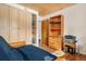 Bedroom with a futon and closet space, featuring a wood ceiling and flooring at 1333 Mariposa Ave, Boulder, CO 80302