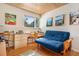 Bedroom with work and seating areas, showcasing artwork and a view to the outdoors at 1333 Mariposa Ave, Boulder, CO 80302