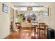 Inviting dining room features hardwood floors, large window providing light, and textured accent wall at 1333 Mariposa Ave, Boulder, CO 80302