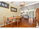 Bright dining area featuring wood floors and an open floor plan to the living room with sliding door at 1333 Mariposa Ave, Boulder, CO 80302