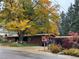 Charming single-story home with mature landscaping and a colorful Autumn tree in the front yard at 1333 Mariposa Ave, Boulder, CO 80302