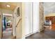 Hallway featuring storage closet, stone accent wall and hardwood floors at 1333 Mariposa Ave, Boulder, CO 80302