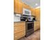 Kitchen showing stainless steel appliances, ample counter space, and wood cabinets with white hardware at 1333 Mariposa Ave, Boulder, CO 80302