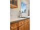 Kitchen counter featuring a stainless steel faucet and sink, wood cabinets and view of the backyard at 1333 Mariposa Ave, Boulder, CO 80302