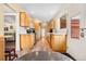 Galley kitchen with stainless appliances and tile floor, door leads to outdoor area for easy access at 1333 Mariposa Ave, Boulder, CO 80302