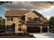 Stunning two-story home with a three-car garage and well-manicured landscaping at 941 Saint Andrews Ln, Louisville, CO 80027