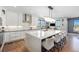 Spacious kitchen with an oversized island, modern appliances, and stylish pendant lighting at 941 Saint Andrews Ln, Louisville, CO 80027
