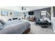 Serene bedroom retreat with ample natural light, sitting area, and stylish decor at 941 Saint Andrews Ln, Louisville, CO 80027