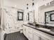 Elegant bathroom with marble walls and double vanity at 2824 Cherry St, Denver, CO 80207