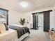 Spacious bedroom with barn door entry to en-suite bathroom at 2824 Cherry St, Denver, CO 80207