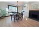 Bright dining room features a table for four, fireplace, and built-in shelving at 2824 Cherry St, Denver, CO 80207