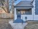 Stylish front entrance with dark door, steps and railing at 2824 Cherry St, Denver, CO 80207