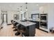 Modern kitchen features stainless steel appliances and an island with seating at 2824 Cherry St, Denver, CO 80207