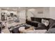 Open floorplan shows living room and kitchen with seamless transition, perfect for entertaining at 21538 E 59Th Pl, Aurora, CO 80019