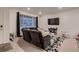 Cozy living room with a large sectional sofa and a plush patterned rug at 21538 E 59Th Pl, Aurora, CO 80019