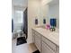 Bathroom featuring a double vanity and modern fixtures, offering style and functionality at 9448 Richfield St, Commerce City, CO 80022