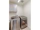 Convenient laundry room with modern, front-loading washer and dryer units at 9448 Richfield St, Commerce City, CO 80022