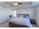 Spacious main bedroom with ceiling fan and a comfortable, large bed at 9448 Richfield St, Commerce City, CO 80022