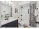 Updated bathroom featuring a vanity with drawers, a shower with new fixtures, and decor at 3855 S Monaco St # 182, Denver, CO 80237