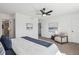 Light and airy bedroom featuring comfortable chair, neutral decor, and serene artwork at 3855 S Monaco St # 182, Denver, CO 80237