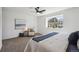 Serene bedroom showcases natural light, cozy chair and carpet, and serene artwork at 3855 S Monaco St # 182, Denver, CO 80237