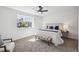 Bright and airy bedroom featuring large window, comfortable chair, and neutral decor at 3855 S Monaco St # 182, Denver, CO 80237