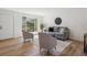 Inviting living area featuring wood floors, a large window, and comfortable, stylish seating arrangements at 3855 S Monaco St # 182, Denver, CO 80237